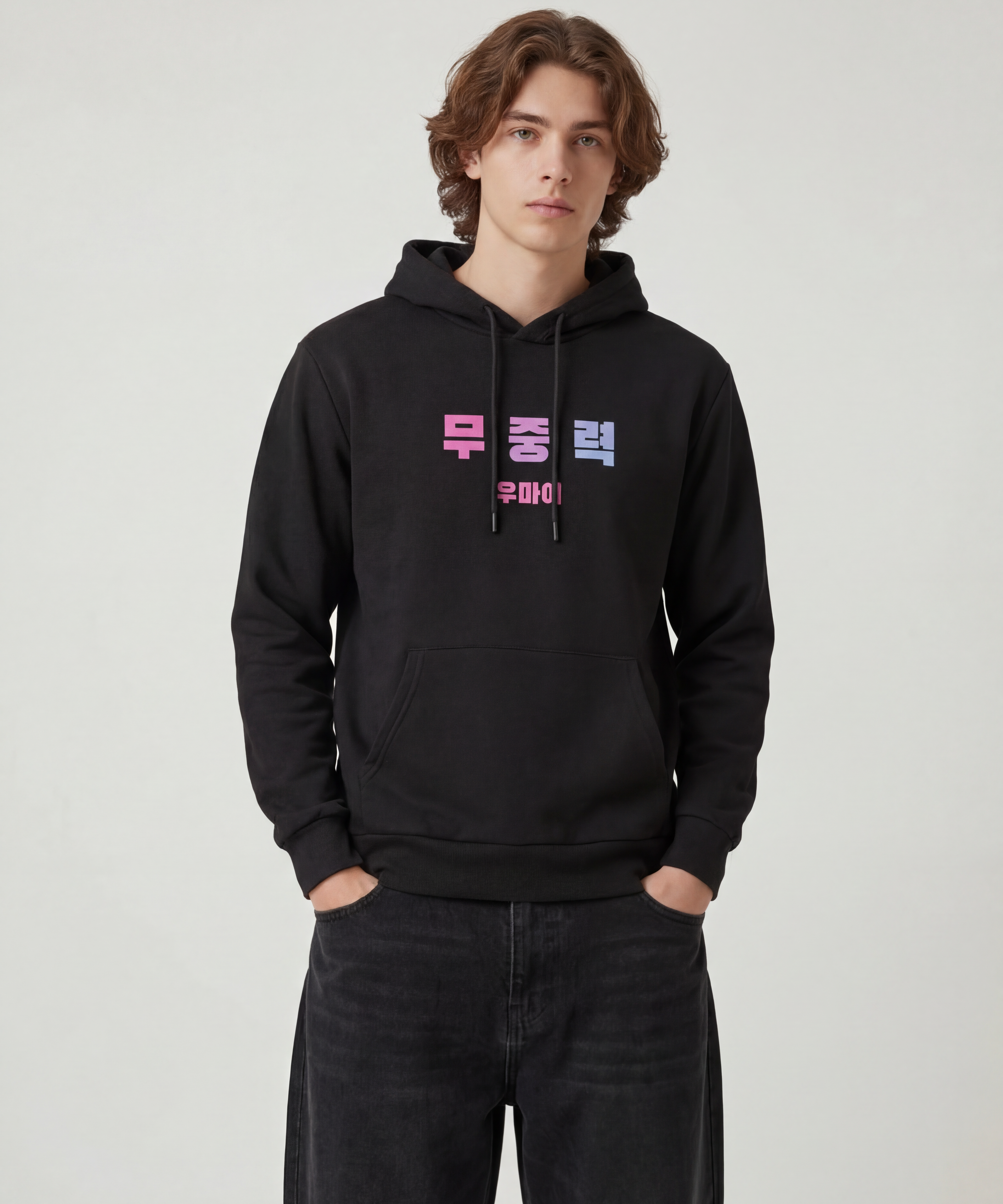 wearing_a_cotton_heritage_hoodie_Model_wearing_baggy_dark_black_jeans_THe_hoodie_is_black_The_aglets_are_not_metal.png