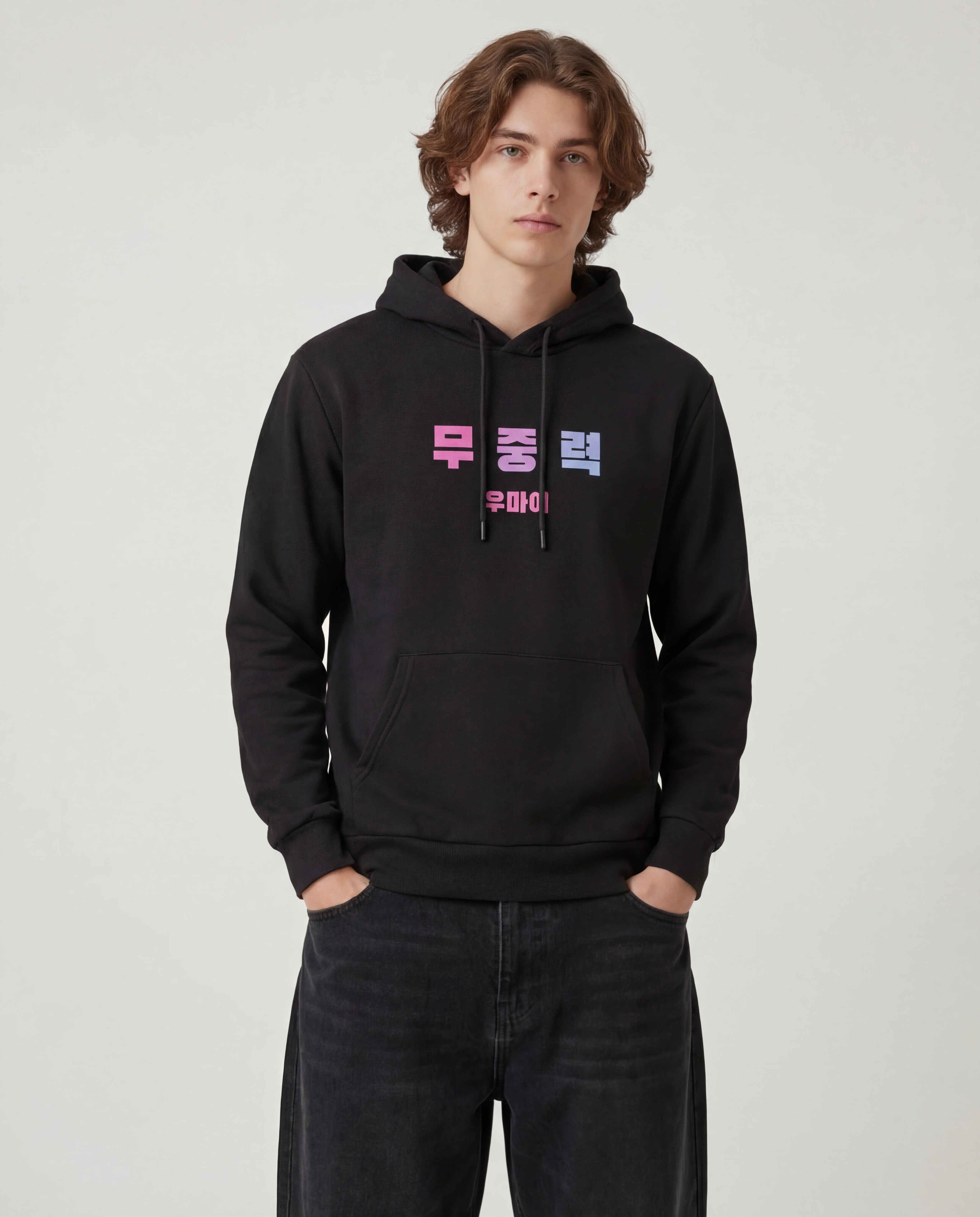 wearing_a_cotton_heritage_hoodie_Model_wearing_baggy_dark_black_jeans_THe_hoodie_is_black_The_aglets_are_not_metal.png