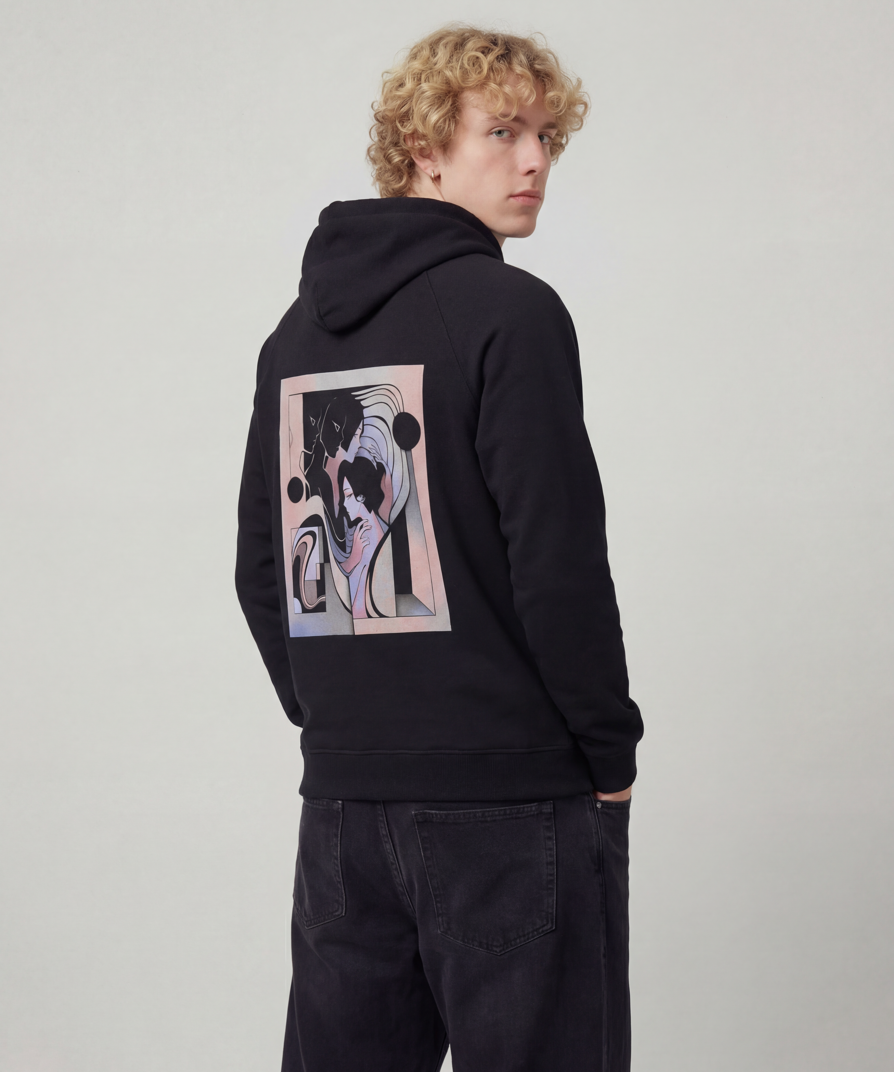 wearing_a_cotton_heritage_hoodie_Model_wearing_baggy_dark_black_jeans_with_a_light_grey_think_hoodie_on_the_graphic_is_on_the_back_the_model_should_be_facing_his_back_to_the_camera_th_1f60583a-53e9-42bc-b065-bb4b5a2d9769.png